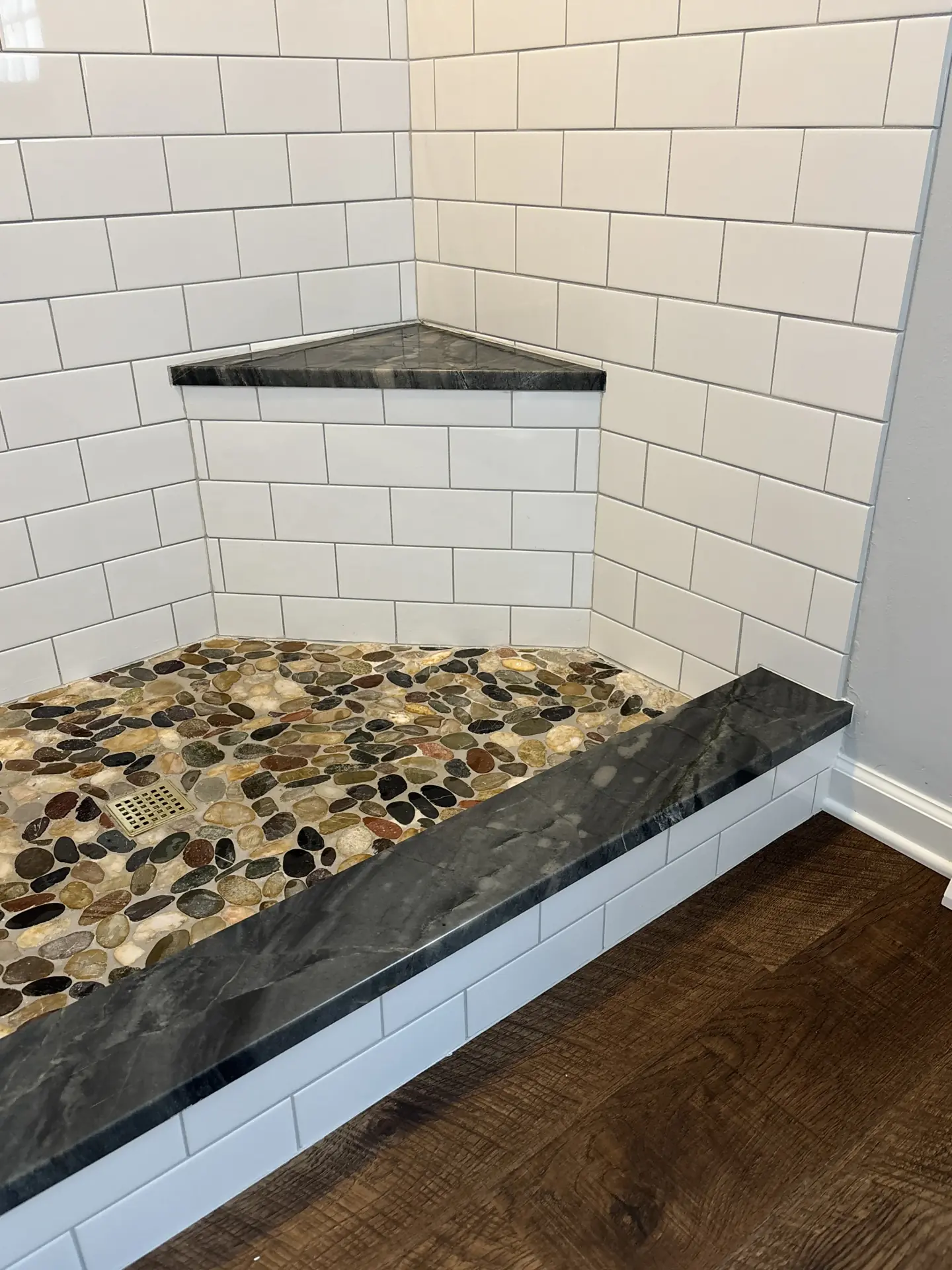 Pebble floor and stone trim detail